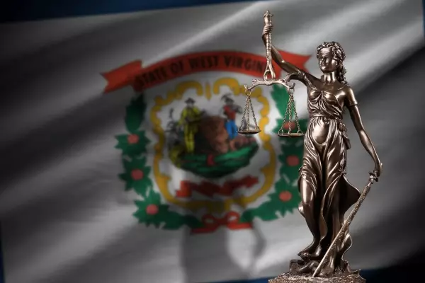 west-virginia-us-state-flag-with-statue-lady-justice-judicial-scales-dark-room-concept-judgement-punishment