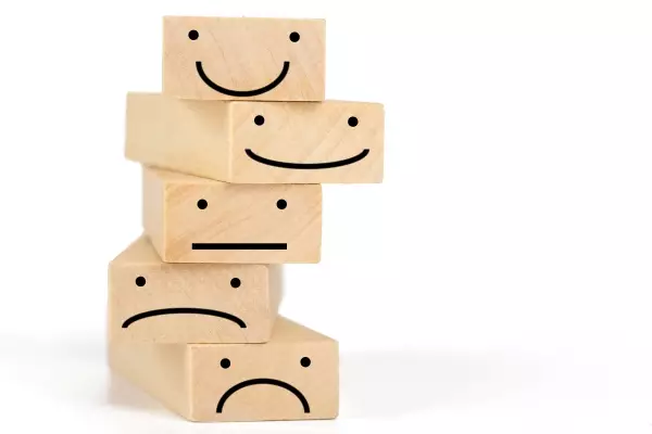 wooden-blocks-with-symbols-smilies-expressing-different-emotions
